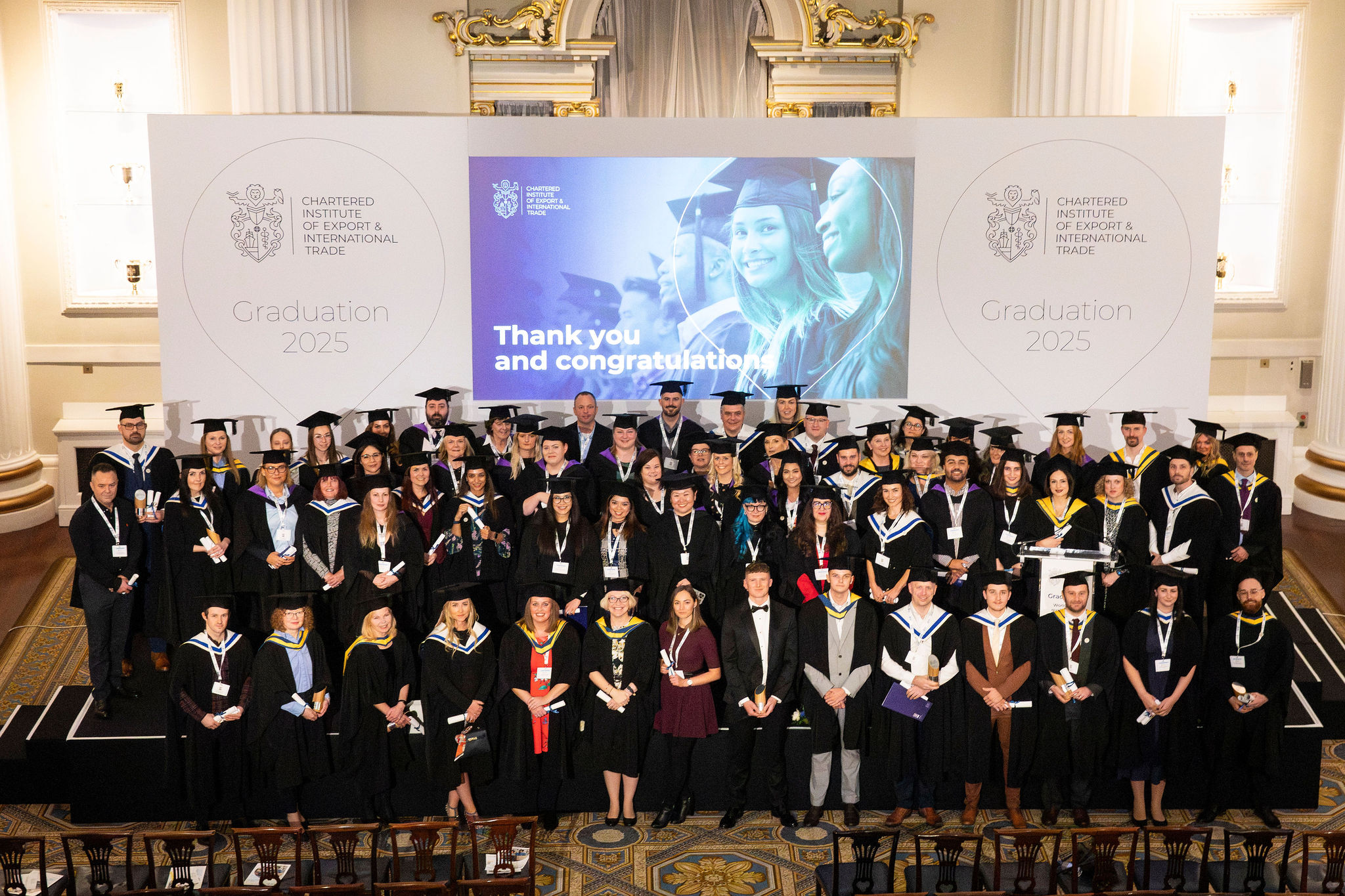 Image of graduates sitting gowned