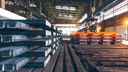 Warehouse full of steel bars stacked on pallets